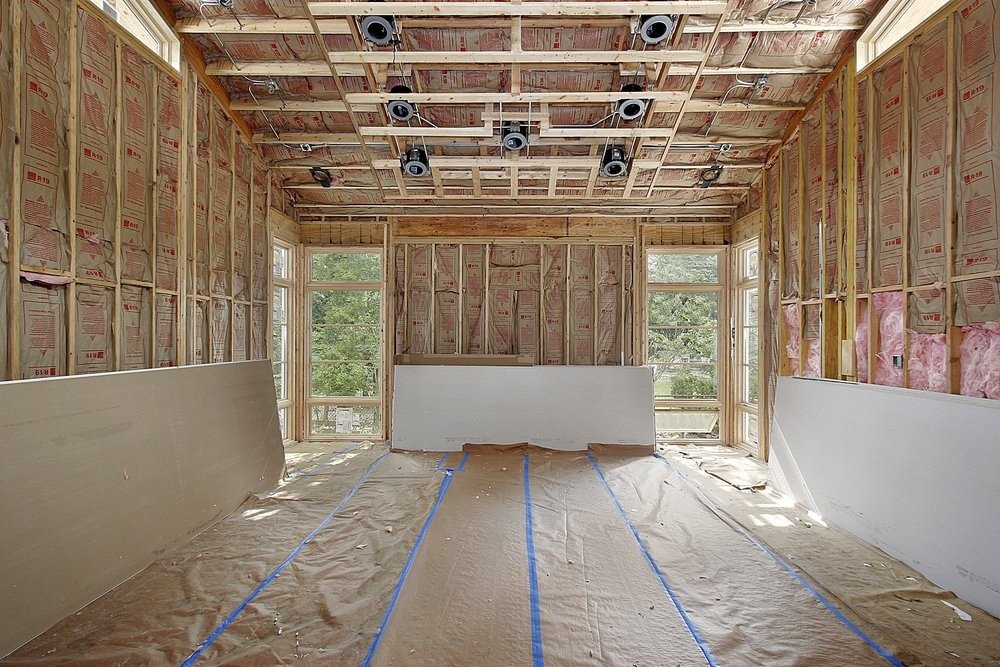 image of partially sheetrocked livingroom with studs visible
