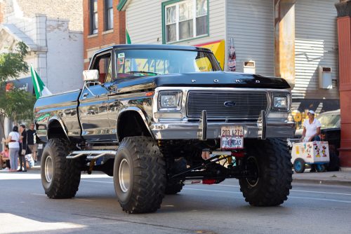 image of a plack lifted truck in a parade