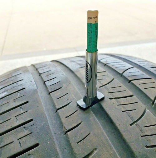 checking remaining tire life by measuring tread depth