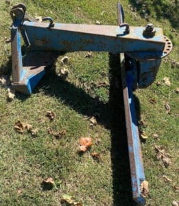 image of blue tractor rear blade
