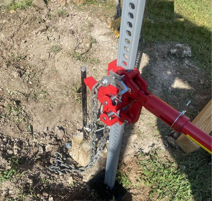 image of hi lift jack and fence post