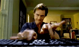 a moving image of Jim Carrey typing madly